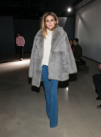Olivia Palermo wearing Blue Flare Jeans, White Cowl-neck Sweater, Grey Fur Coat