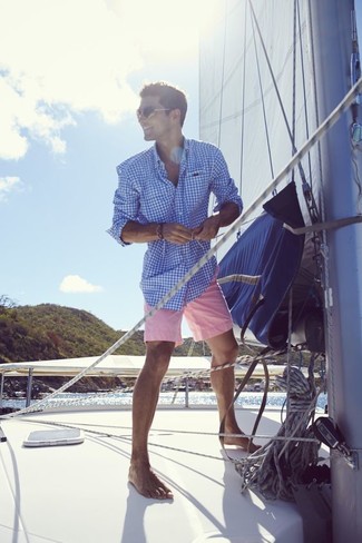 Hot Pink Shorts Outfits For Men: To achieve a relaxed casual ensemble with a modernized spin, make a blue gingham long sleeve shirt and hot pink shorts your outfit choice.