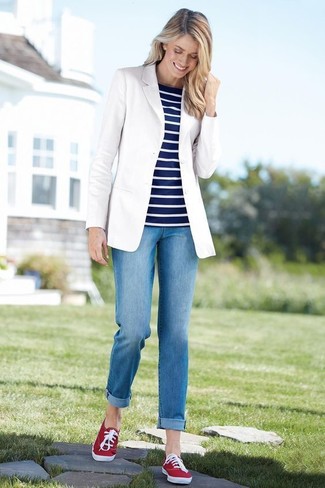 Women's Red Canvas Low Top Sneakers, Blue Jeans, Navy and White Horizontal Striped Crew-neck Sweater, White Blazer