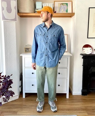 Orange Baseball Cap Outfits For Men: A blue chambray long sleeve shirt and an orange baseball cap paired together are a wonderful match. Let your outfit coordination savvy truly shine by rounding off this ensemble with a pair of grey athletic shoes.