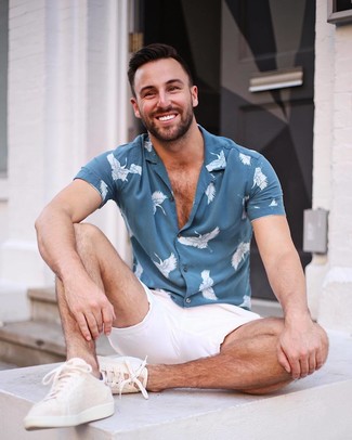 Navy Print Short Sleeve Shirt Outfits For Men: If you gravitate towards casual style, why not consider this combination of a navy print short sleeve shirt and white shorts? Now all you need is a cool pair of beige leather low top sneakers to complement this getup.