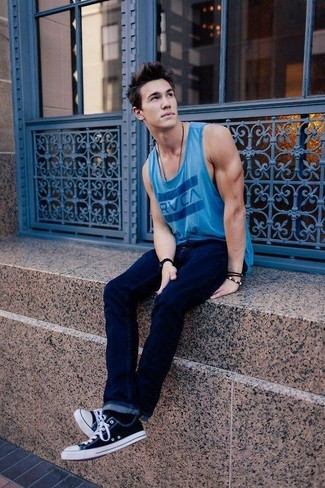 Blue Print Tank Outfits For Men: A blue print tank and navy jeans are a nice outfit to have in your daily off-duty fashion mix. For something more on the sophisticated end to finish this outfit, complete this getup with a pair of black and white low top sneakers.
