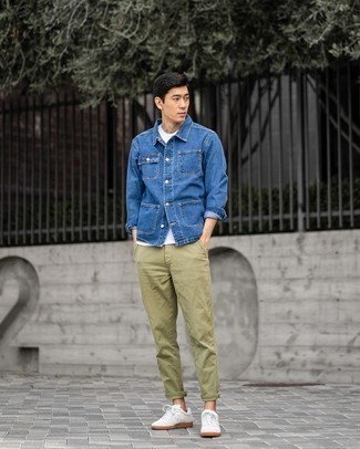 Blue Denim Shirt Jacket Outfits For Men: A blue denim shirt jacket and olive chinos? This combination will turn every head in the proximity. Got bored with this ensemble? Let a pair of white canvas low top sneakers switch things up.