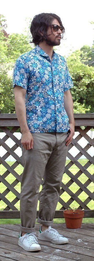 Men's Blue Floral Short Sleeve Shirt, Grey Chinos, White and Green Leather Low Top Sneakers, Dark Brown Sunglasses