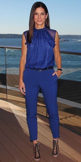 Navy Skinny Pants Outfits: Exhibit your styling credentials in this casual pairing of a blue sleeveless top and navy skinny pants. To give your overall look a dressier finish, complement your ensemble with black leather heeled sandals.