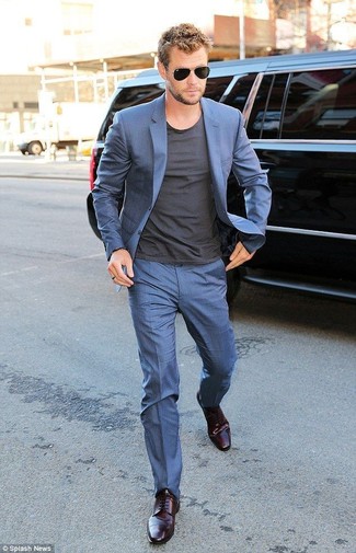Chris Hemsworth wearing Blue Suit, Charcoal Crew-neck T-shirt, Dark Purple Leather Derby Shoes, Black Sunglasses