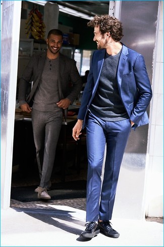 Navy Crew-neck Sweater Warm Weather Outfits For Men: Pairing a navy crew-neck sweater with a blue suit is a wonderful pick for a sharp and elegant outfit. Complete this look with black leather low top sneakers to inject a dose of stylish effortlessness into your outfit.