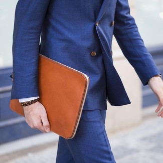 Tobacco Leather Zip Pouch Outfits For Men: Pair a blue suit with a tobacco leather zip pouch to pull together an interesting and modern-looking casual outfit.