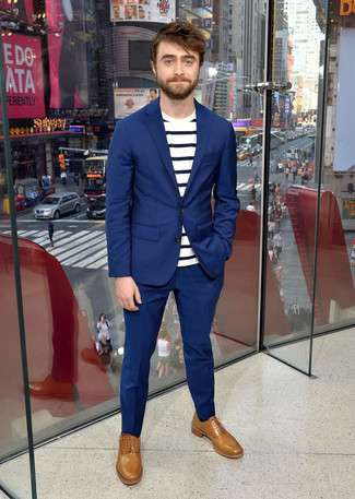 A blue suit and a white and navy horizontal striped crew-neck t-shirt are surely worth adding to your list of veritable menswear staples. You know how to dress it up: tan leather oxford shoes.