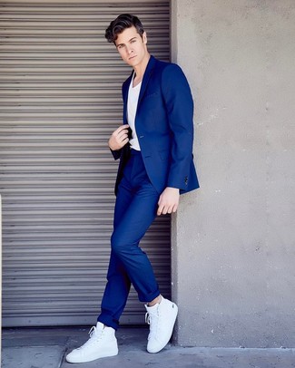 White and Navy Leather High Top Sneakers Outfits For Men: This combo of a blue suit and a white crew-neck t-shirt is definitive proof that a pared down ensemble doesn't have to be boring. Complement your outfit with white and navy leather high top sneakers to keep the ensemble fresh.