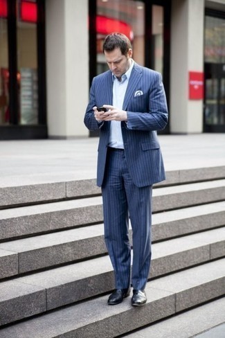 Navy Vertical Striped Suit Outfits: A navy vertical striped suit and a white dress shirt are absolute essentials if you're picking out a polished closet that matches up to the highest men's style standards. Black leather chelsea boots are guaranteed to add an element of stylish casualness to your outfit.