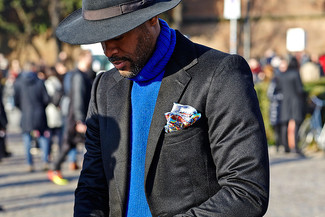 Black Hat Outfits For Men: Try teaming a blue knit turtleneck with a black hat to pull together an interesting and laid-back ensemble.