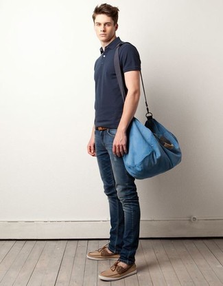 Men's Blue Canvas Duffle Bag, Tan Suede Boat Shoes, Navy Ripped Skinny Jeans, Charcoal Polo
