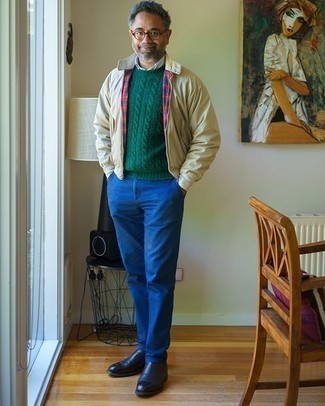 Dark Green Cable Sweater Outfits For Men: For comfort dressing with a modern finish, consider teaming a dark green cable sweater with blue chinos. If you need to immediately perk up this look with a pair of shoes, complete your outfit with navy leather chelsea boots.