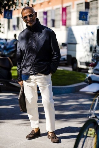 Navy Bomber Jacket Outfits For Men: For effortless style without the need to sacrifice on comfort, we love this combo of a navy bomber jacket and white chinos. Puzzled as to how to complement your outfit? Rock a pair of dark brown suede tassel loafers to rev up the classy factor.
