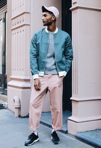 Aquamarine Bomber Jacket Outfits For Men: An aquamarine bomber jacket and pink chinos are a great combo worth having in your day-to-day outfit choices. Black low top sneakers are a surefire way to add a hint of stylish effortlessness to this outfit.
