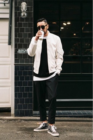 Black Crew-neck Sweater Outfits For Men: A black crew-neck sweater and black chinos teamed together are a wonderful match. On the fence about how to round off? Complete this look with grey canvas high top sneakers for a more relaxed twist.