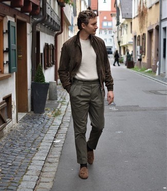 Dark Brown Suede Bomber Jacket Outfits For Men: This combo of a dark brown suede bomber jacket and olive dress pants will add refined essence to your outfit. Brown suede tassel loafers look wonderful complementing this getup.