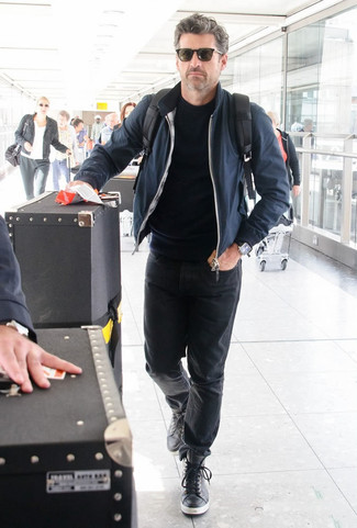 Patrick Dempsey wearing Navy Bomber Jacket, Black Crew-neck Sweater, Black Jeans, Black Leather High Top Sneakers