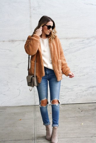 Tan Fleece Bomber Jacket Outfits For Women: A tan fleece bomber jacket and blue ripped jeans are great items to have in your daily styling rotation. Complete your outfit with a pair of grey suede ankle boots to take things up a notch.
