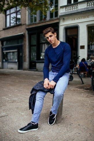 Blue Crew-neck Sweater Outfits For Men: To don a casual look with a clear fashion twist, you can easily wear a blue crew-neck sweater and light blue jeans. Our favorite of an endless number of ways to complete this getup is with a pair of black leather low top sneakers.