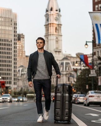 Black Suitcase Outfits For Men: Undeniable proof that a black bomber jacket and a black suitcase are awesome when teamed together in a laid-back getup. If you want to feel a bit fancier now, add a pair of white leather low top sneakers to the equation.