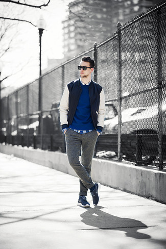 For a casual outfit, pair a black and white leather bomber jacket with grey wool chinos — these two pieces work pretty good together. Why not complete this ensemble with a pair of navy low top sneakers for a hint of stylish casualness?