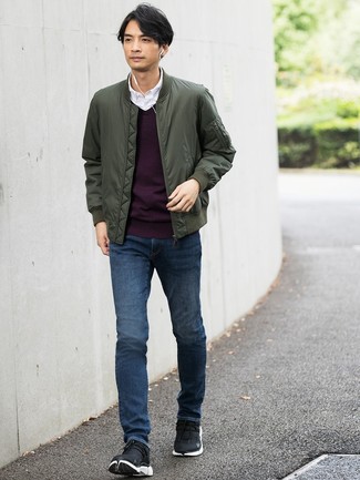 Purple Crew-neck Sweater Outfits For Men: This pairing of a purple crew-neck sweater and navy jeans is extra stylish and provides instant cool. To bring a mellow feel to this look, complete this look with a pair of black athletic shoes.