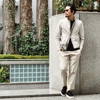 Beige Vertical Striped Chinos Outfits: Master the cool and casual look by opting for a grey bomber jacket and beige vertical striped chinos. Complete your getup with a pair of black suede low top sneakers to tie the whole thing together.