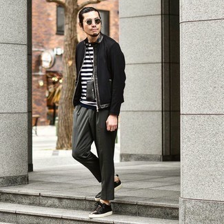 Black Bomber Jacket Outfits For Men: Opt for a black bomber jacket and charcoal chinos to assemble a really stylish and current off-duty ensemble. You could perhaps get a little creative on the shoe front and add a pair of black leather low top sneakers to the mix.