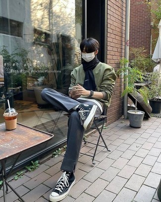 Black Scarf Outfits For Men: Team an olive bomber jacket with a black scarf if you want to look casual and cool without putting in too much time. Add black and white canvas high top sneakers to the equation to completely change up the outfit.