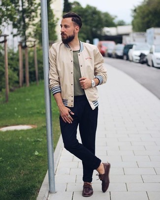 Dark Green Crew-neck T-shirt Outfits For Men: A dark green crew-neck t-shirt and black chinos are indispensable menswear staples to have in your casual box. Complete this look with dark brown leather boat shoes et voila, your look is complete.