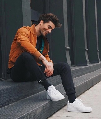 Dark Brown Bomber Jacket Outfits For Men: A dark brown bomber jacket and black chinos are the kind of a never-failing off-duty getup that you need when you have no time to craft an ensemble. White leather low top sneakers are a guaranteed way to give a sense of stylish effortlessness to your look.