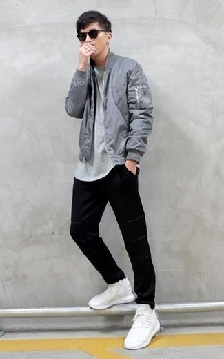 Grey Bomber Jacket Outfits For Men: Look on-trend yet casual by opting for a grey bomber jacket and black chinos. Rev up this whole ensemble by sporting white athletic shoes.