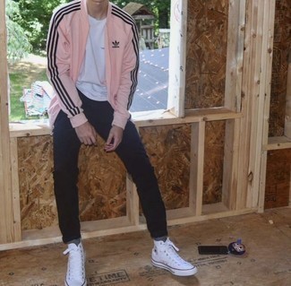 Pink Bomber Jacket Outfits For Men: This combo of a pink bomber jacket and black chinos is undeniable proof that a straightforward casual outfit can still be incredibly dapper. Inject a more casual vibe into your getup with white canvas high top sneakers.