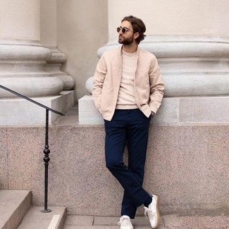 Brown Sunglasses Outfits For Men: This combination of a beige bomber jacket and brown sunglasses is proof that a safe casual look doesn't have to be boring. To introduce a bit of fanciness to this getup, complete your look with white canvas low top sneakers.