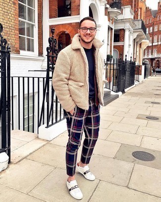 Navy Plaid Chinos Outfits: Go for a simple but at the same time casually cool choice by wearing a beige fleece bomber jacket and navy plaid chinos. Introduce white print leather low top sneakers to the equation for maximum effect.