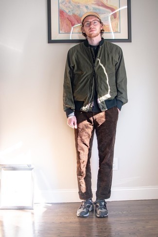Olive Bomber Jacket Outfits For Men: An olive bomber jacket looks so cool when paired with brown corduroy chinos in a relaxed look. Bring a fun feel to this outfit by slipping into a pair of charcoal athletic shoes.