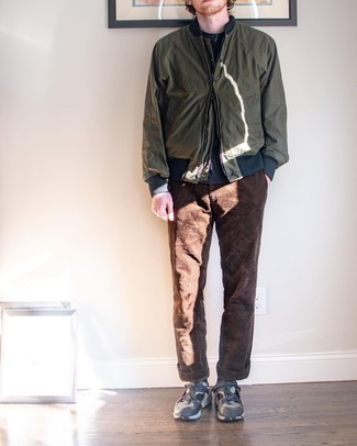 Olive Bomber Jacket Outfits For Men: If you're seeking to take your casual game to a new level, pair an olive bomber jacket with brown corduroy chinos. Complement your look with charcoal athletic shoes to make the look less formal.