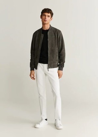 Dark Green Suede Bomber Jacket Outfits For Men: Consider wearing a dark green suede bomber jacket and white chinos for a casually edgy and stylish getup. Infuse a hint of stylish effortlessness into your outfit by rounding off with white canvas low top sneakers.