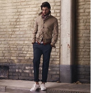 Tan Bomber Jacket Outfits For Men: A tan bomber jacket and navy chinos paired together are a perfect match. Don't know how to round off? Add white canvas low top sneakers to your getup to mix things up a bit.