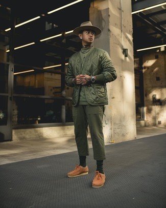 Hat Outfits For Men: Make an olive quilted satin bomber jacket and a hat your outfit choice to create an interesting and city casual ensemble. Tobacco suede desert boots will put a sleeker spin on this ensemble.