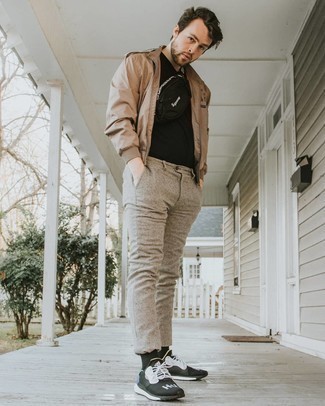 Tan Bomber Jacket Outfits For Men In Their 30s: A tan bomber jacket and khaki chinos are wonderful menswear staples that will integrate well within your current casual collection. A pair of black and white athletic shoes introduces a more laid-back aesthetic to the ensemble. If you're often not sure how to dress maturely, this combination is a good illustration.