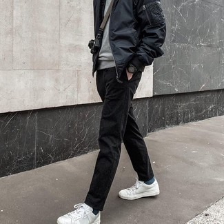 Black Chinos Outfits: This casual combo of a black nylon bomber jacket and black chinos is a surefire option when you need to look great in a flash. Finishing off with white leather low top sneakers is an effective way to inject a more relaxed touch into your look.