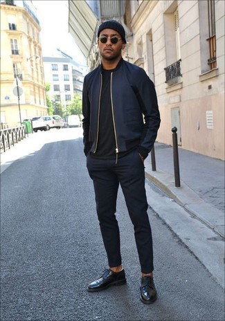 Team a navy bomber jacket with navy dress pants for a truly stylish ensemble. Black leather derby shoes are a tested footwear style here that's full of personality.