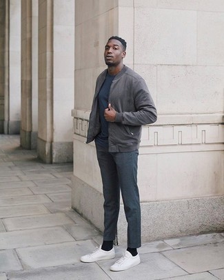 Charcoal Bomber Jacket Outfits For Men: Putting together a charcoal bomber jacket and navy dress pants is a fail-safe way to infuse personality into your current wardrobe. A good pair of white canvas low top sneakers is an easy way to add a hint of stylish casualness to your look.