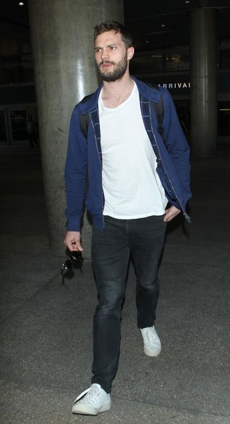 Jamie Dornan wearing Navy Bomber Jacket, White Crew-neck T-shirt, Black Jeans, White Low Top Sneakers