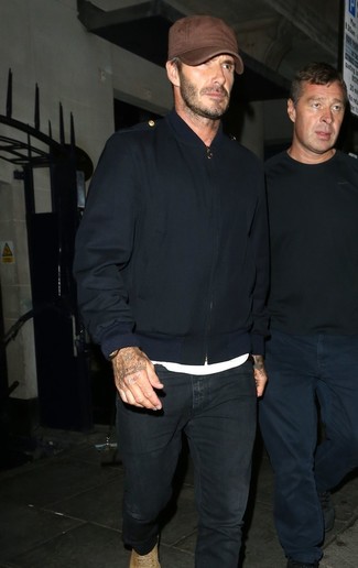 David Beckham wearing Navy Bomber Jacket, White Crew-neck T-shirt, Black Jeans, Tan Suede Casual Boots