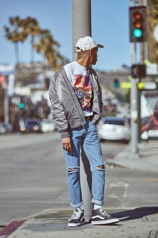 Black and White High Top Sneakers Outfits For Men: Dress in a grey quilted nylon bomber jacket and light blue ripped jeans, if you want to dress for comfort without looking like a hobo to look stylish. Complete this ensemble with black and white high top sneakers and off you go looking boss.