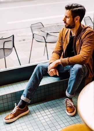 Brown Bomber Jacket Outfits For Men: Wear a brown bomber jacket and blue jeans for a straightforward getup that's also pulled together. Let your outfit coordination chops really shine by complementing your outfit with tobacco leather low top sneakers.